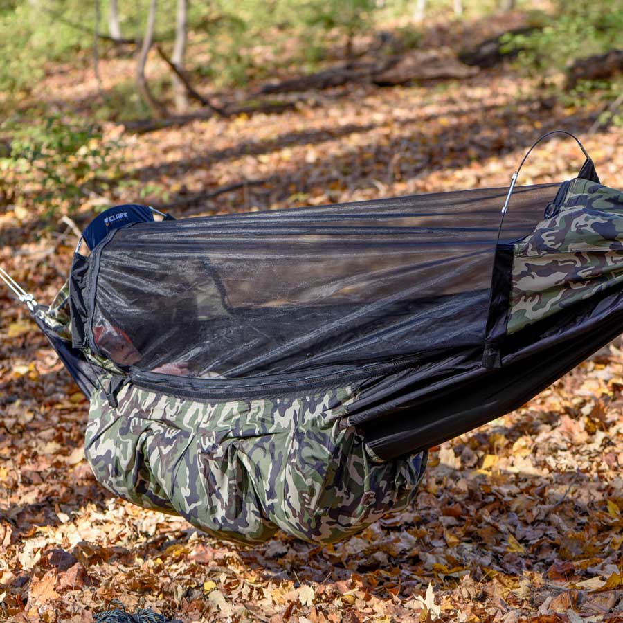 Clark NX-270 with its mosquito net and camo storage pockets, hung in the woods