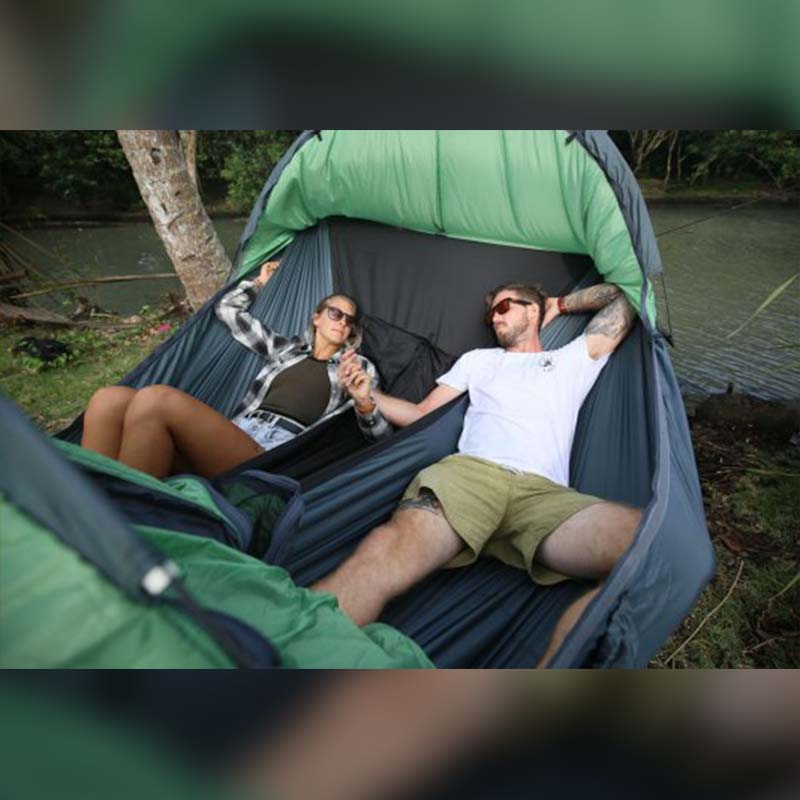 Two campers relaxing side by side in a Clark VX-Ultra by a river